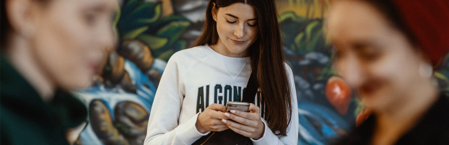 student on phone with students