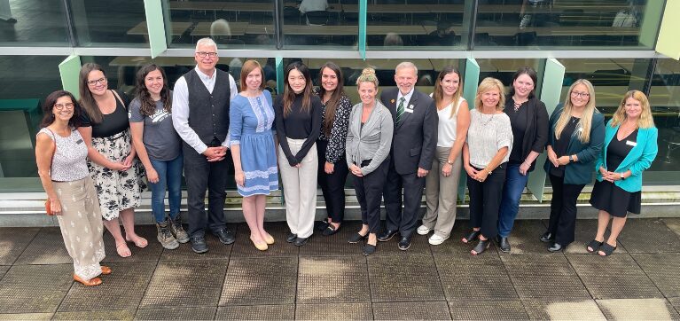 Tanya Buckley, Senior Vice President, Cardel Homes Ontario Division, poses for a photo with 10 of her female staff members, and Algonquin College President and CEO Claude Brulé, Chris Hahn, Dean, ACCE and Perth, Nancy Druick, Manager, Philanthropy, Mistalyn Seguin, Director, Philanthropy, and Amanda Selvey, Chair, Architecture, Civil and Construction.